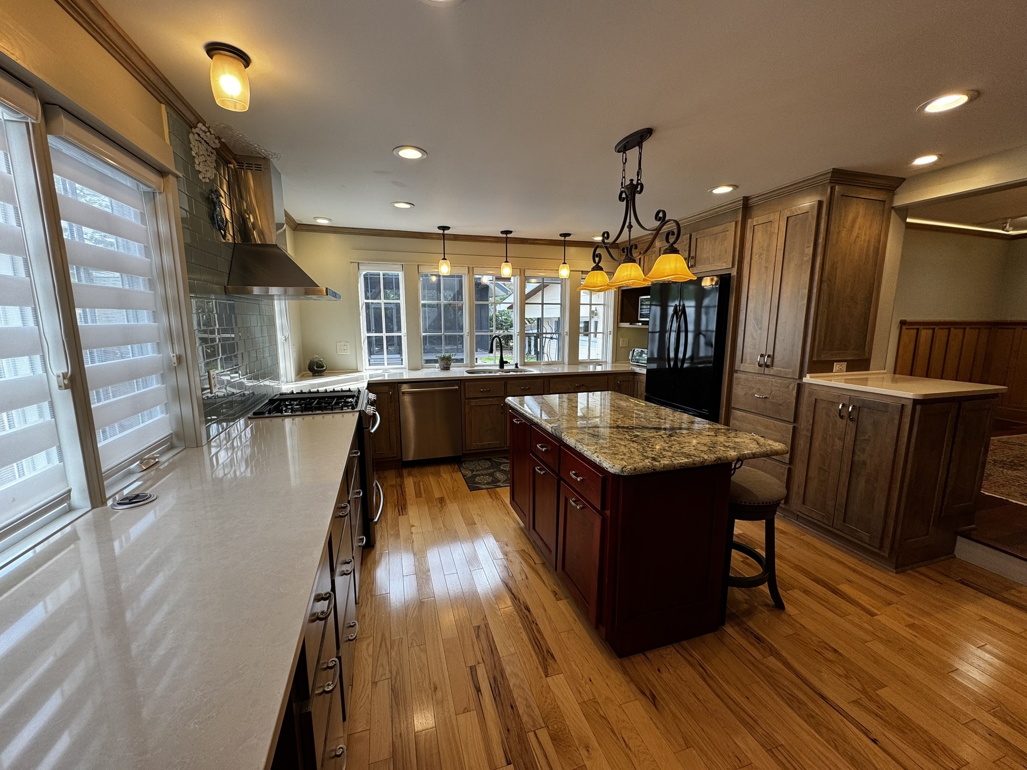 105 Wilson Street Cowan, TN 37318 - Photo 16 of 57 a kitchen with stainless steel appliances granite countertop a stove and a refrigerator