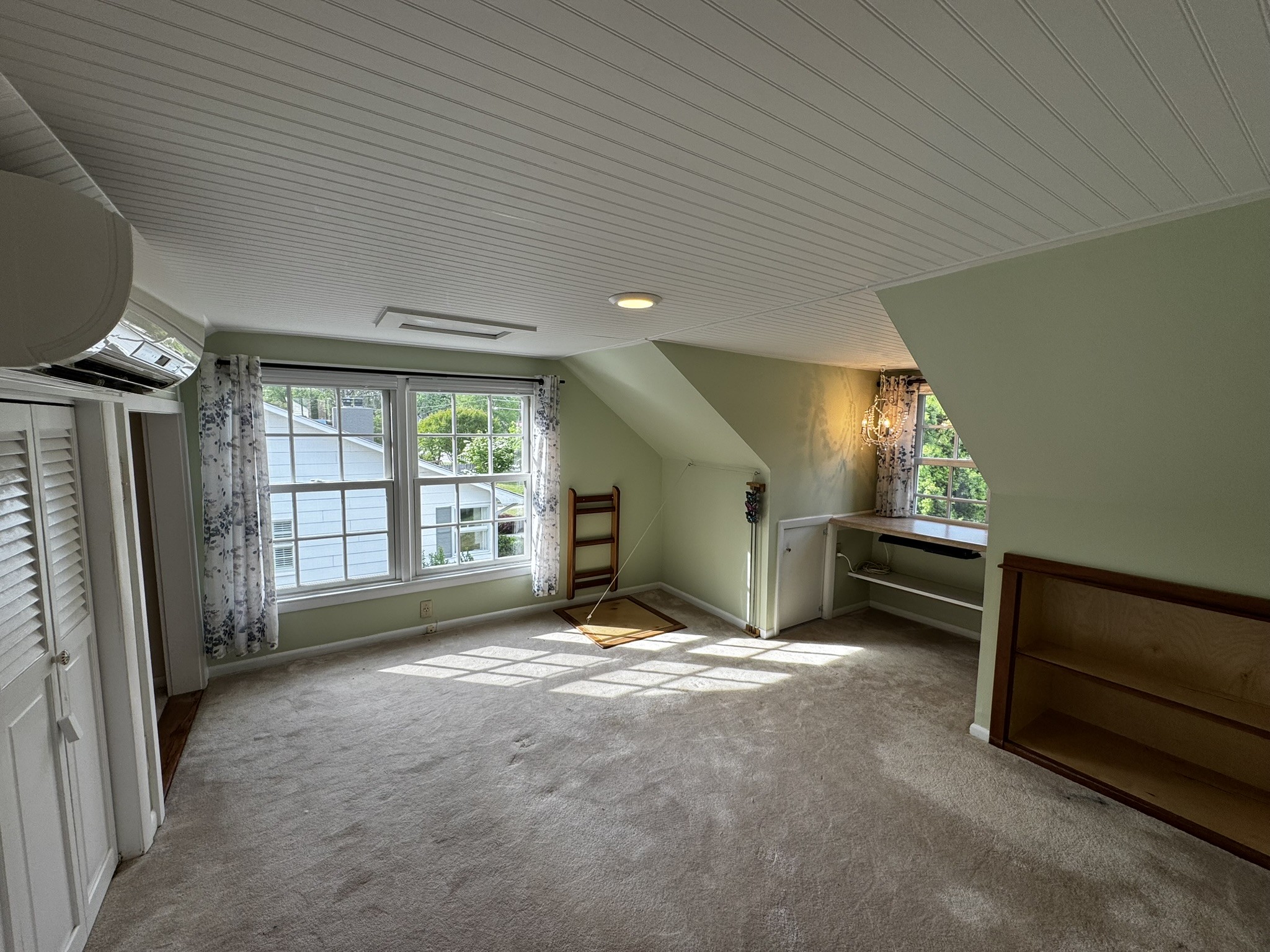 105 Wilson Street Cowan, TN 37318 - Photo 22 of 57 a view of an empty room with a fireplace and a window