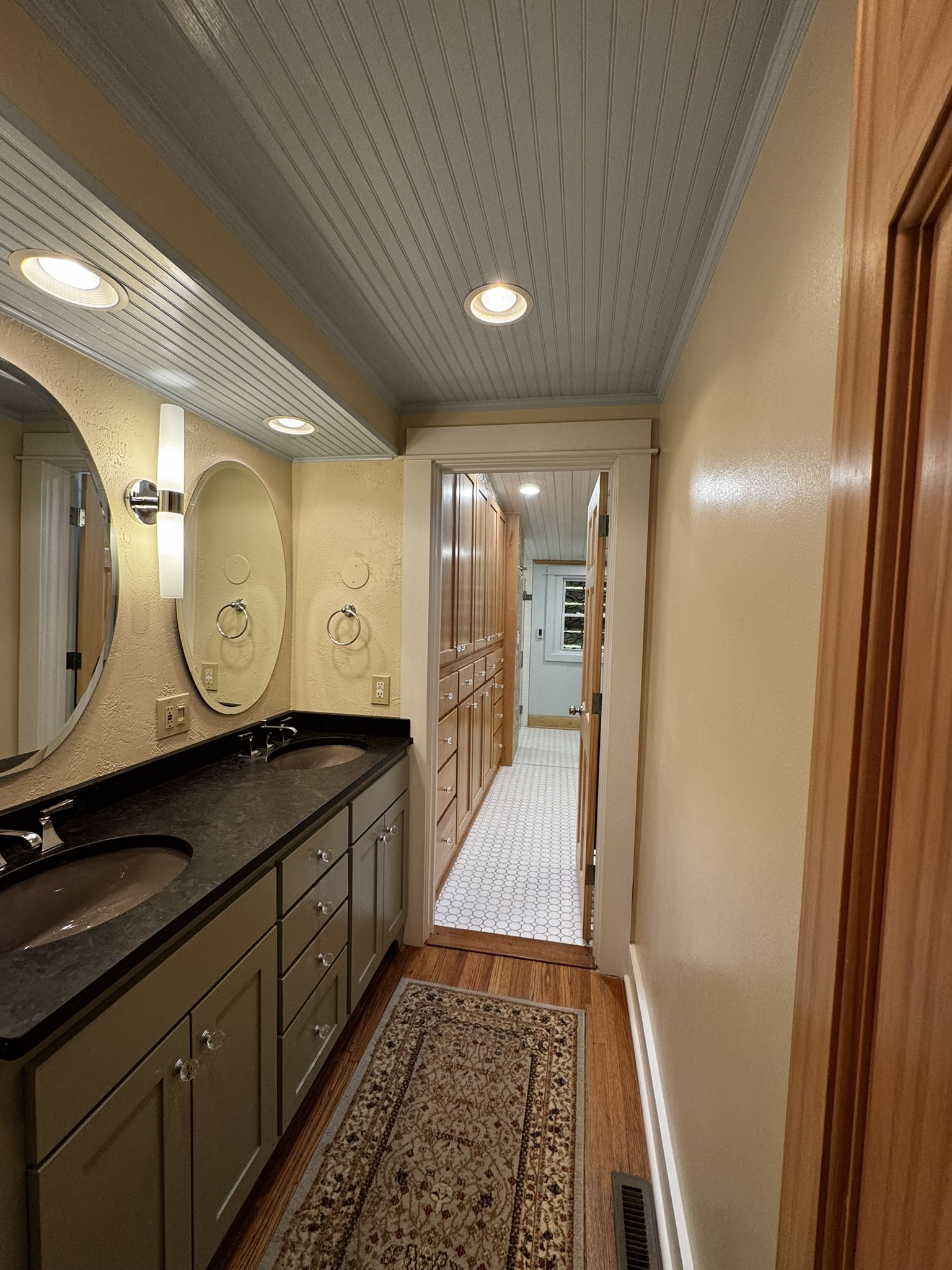 105 Wilson Street Cowan, TN 37318 - Photo 48 of 57 a bathroom with a sink a mirror and a shower