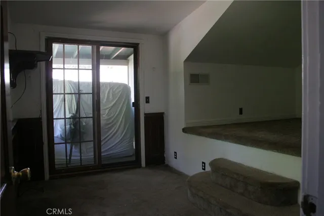 a kitchen with granite countertop wooden cabinets and a sink
