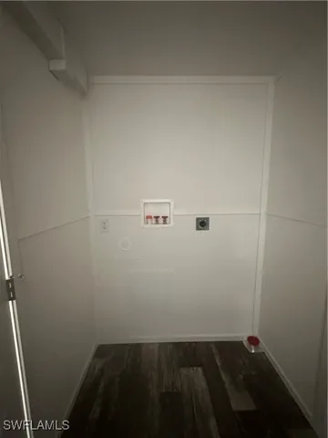 a backyard of a house with lots of green space and fountain