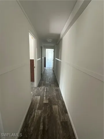 a view of a backyard with large trees