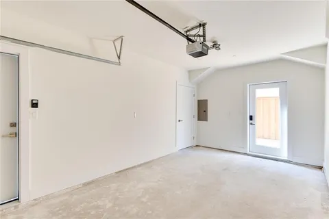 a view of a big room with closet and windows