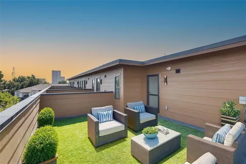 a view of a patio in the backyard