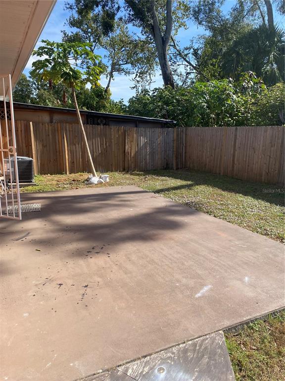 3336 West Heiter Street Tampa, FL 33607 - Photo 4 of 5 a view of backyard with wooden fence