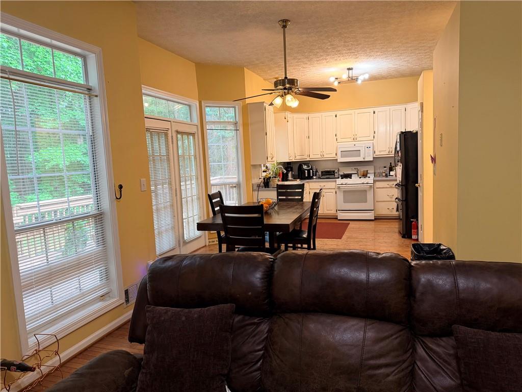 426 Pates Lake Court Hampton, GA 30228 - Photo 15 of 60 a living room with furniture and a large window