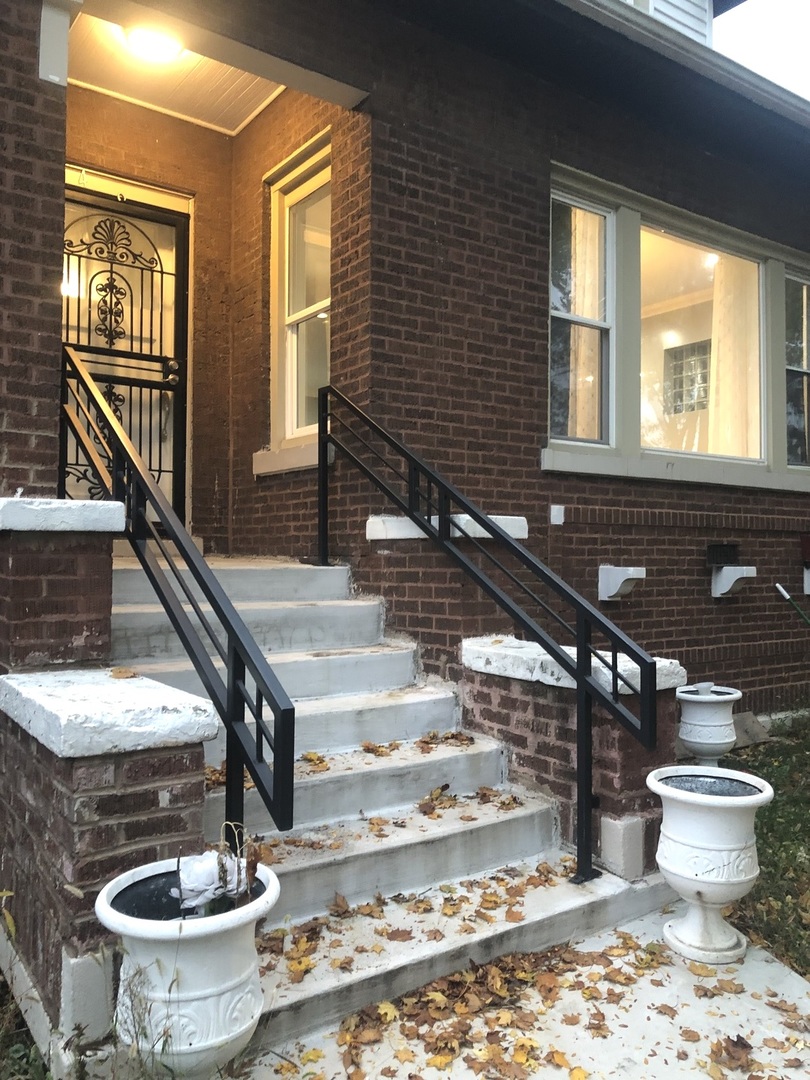 a bathroom with a sink a toilet and a window