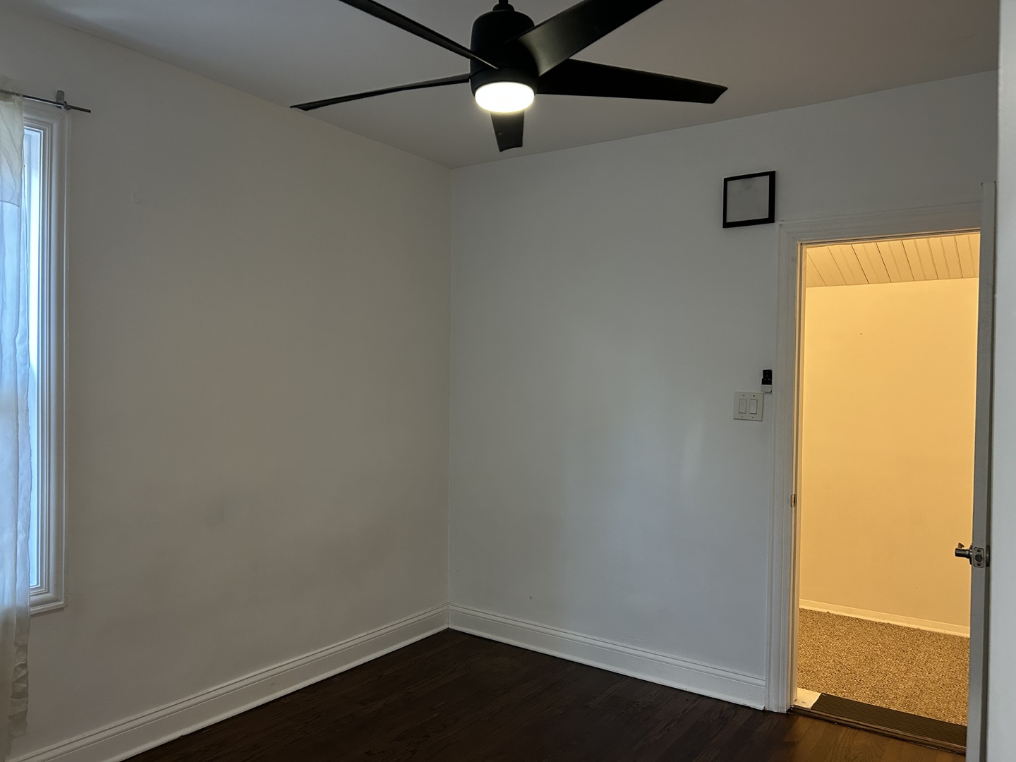 4858 West Concord Place, Unit 1 Chicago, IL 60639 - Photo 11 of 14 a view of an empty room with wooden floor and a window