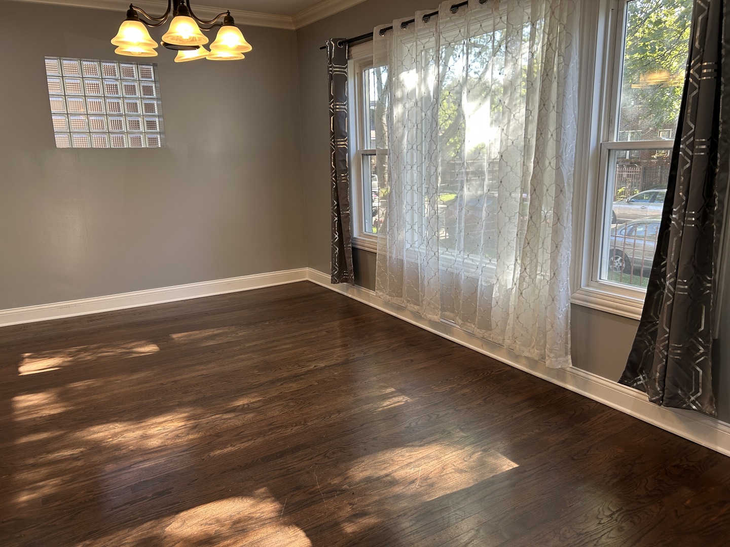 4858 West Concord Place, Unit 1 Chicago, IL 60639 - Photo 2 of 14 a view of empty room with wooden floor and fan