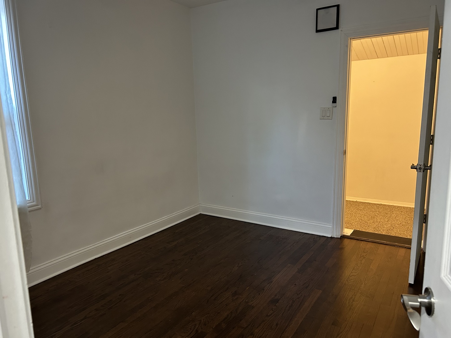 4858 West Concord Place, Unit 1 Chicago, IL 60639 - Photo 10 of 14 an empty room with wooden floor and windows
