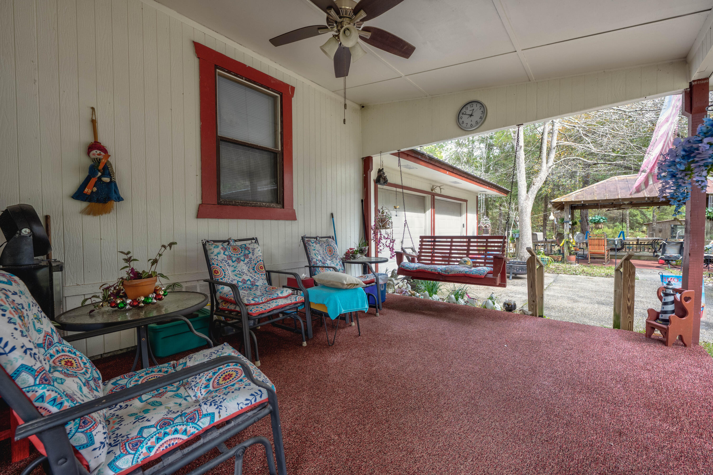 248 Bunny Lane Freeport, FL 32439 - Photo 5 of 27 a living room with furniture and a floor to ceiling window