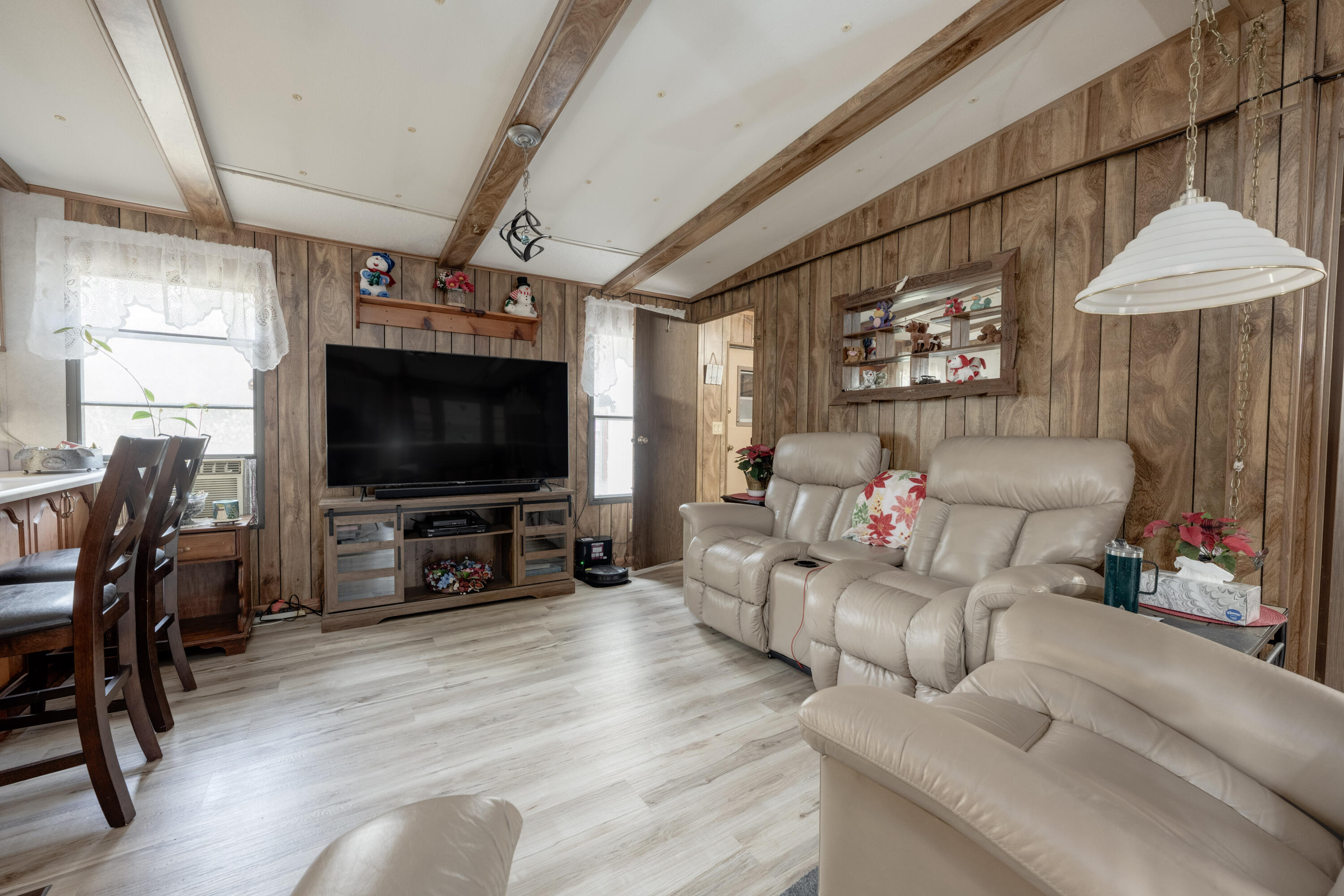 248 Bunny Lane Freeport, FL 32439 - Photo 6 of 27 a living room with furniture and a flat screen tv