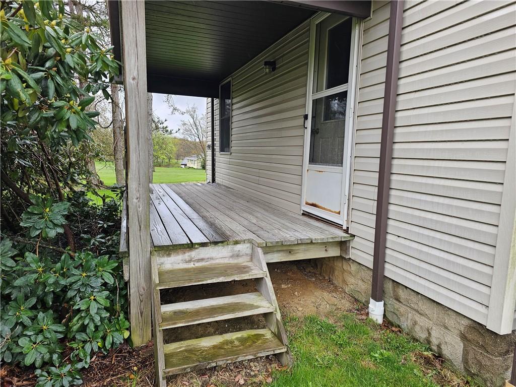 1903 Sandy Lake-Grove City Road Jackson Center, PA 16133 - Photo 3 of 24 a view of balcony with wooden floor and fence