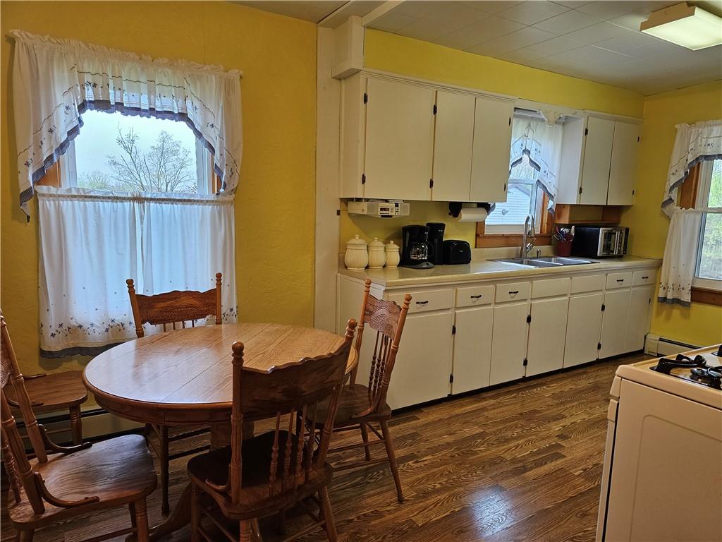 1903 Sandy Lake-Grove City Road Jackson Center, PA 16133 - Photo 4 of 24 a view of a dining room with furniture and wooden floor