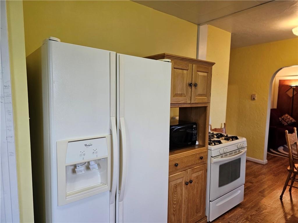 1903 Sandy Lake-Grove City Road Jackson Center, PA 16133 - Photo 5 of 24 a kitchen with a refrigerator and a stove