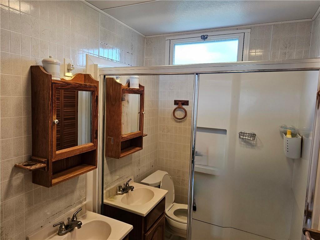 1903 Sandy Lake-Grove City Road Jackson Center, PA 16133 - Photo 8 of 24 a bathroom with a sink and mirror