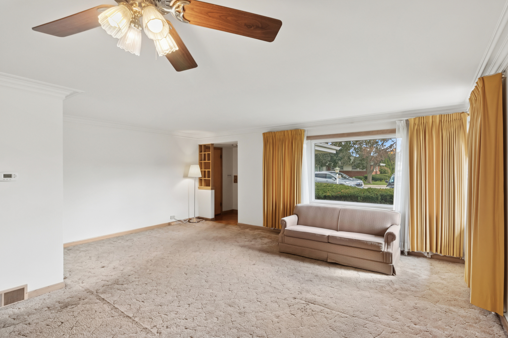 5704 North Ozark Avenue Chicago, IL 60631 - Photo 5 of 24 a living room with furniture and a large window