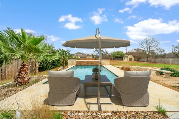 a patio with table and chairs