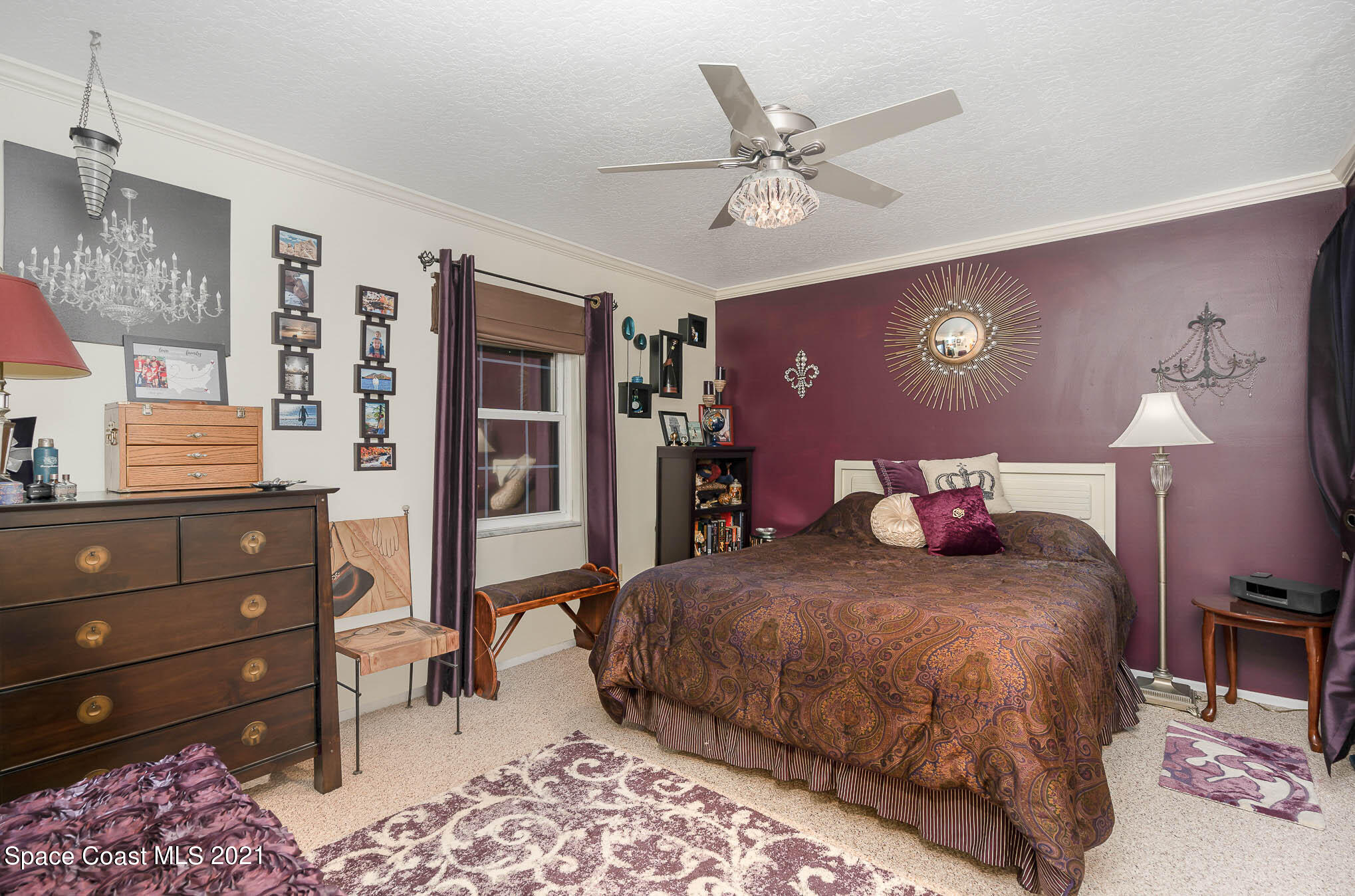 1291 Creel Road Northeast Palm Bay, FL 32905 - Photo 14 of 31 a bedroom with a bed and a dresser in it