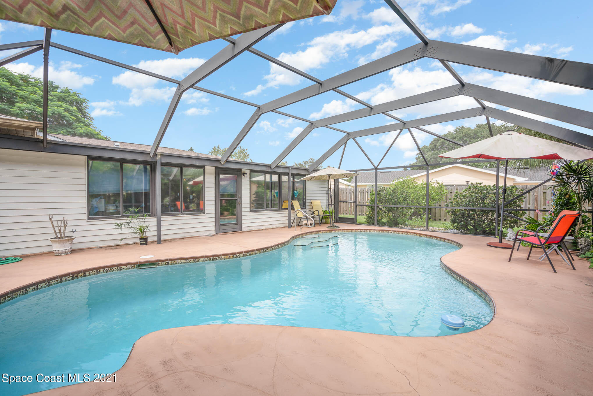 1291 Creel Road Northeast Palm Bay, FL 32905 - Photo 21 of 31 a view of a backyard with a swimming pool