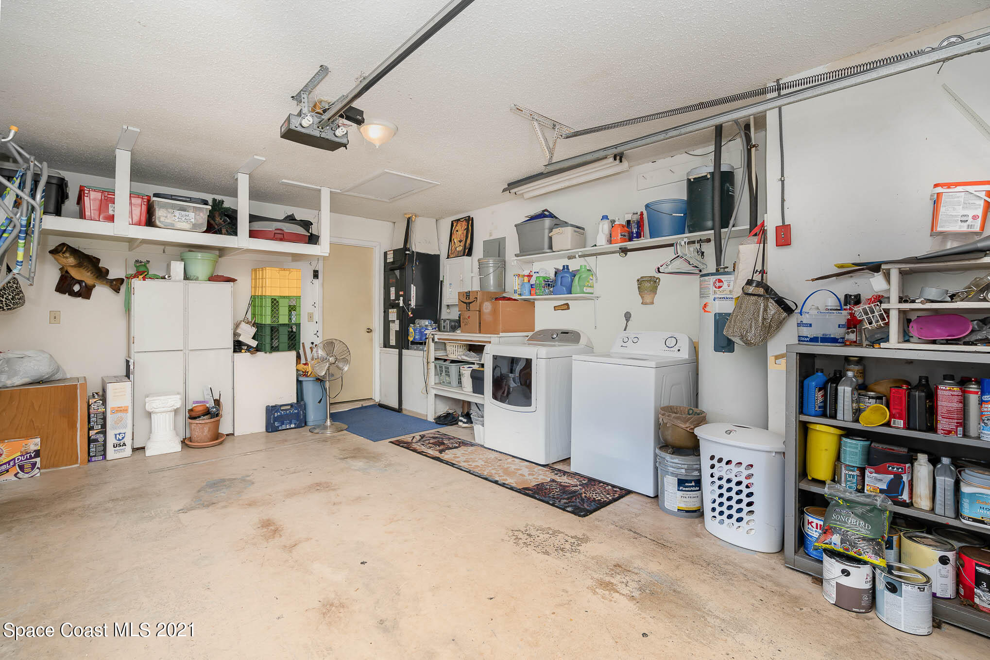 1291 Creel Road Northeast Palm Bay, FL 32905 - Photo 31 of 31 a room with furniture and a book shelf