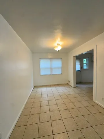 a view of an empty room and window