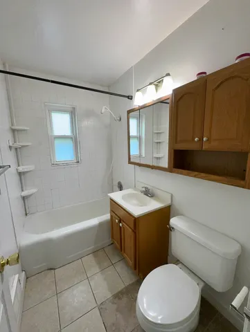 a bathroom with a sink a toilet and bathtub