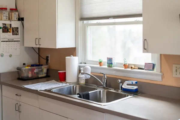 a kitchen with a sink and cabinets