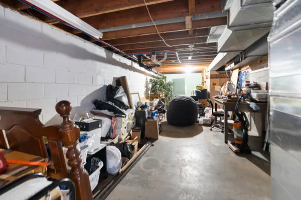 a front view of a house with a garden and trees