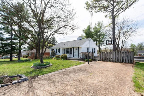 a view of a balcony with wooden floor and fence