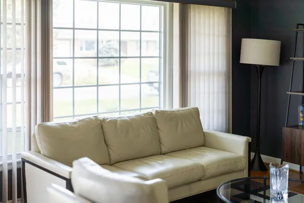 a living room with furniture and a window