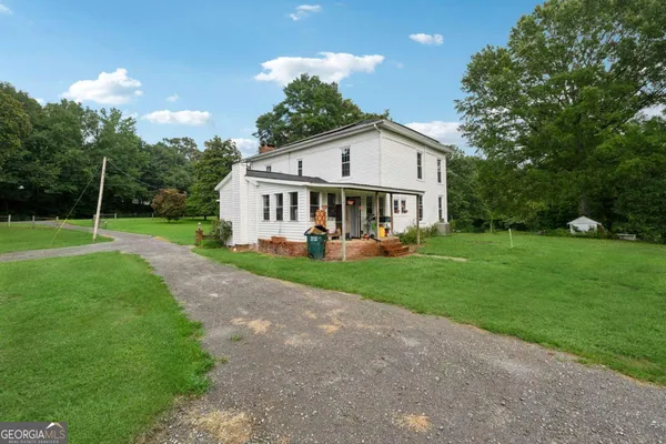 a view of a house with a big yard