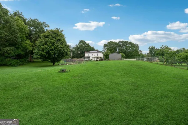 a backyard of a house with lots of green space