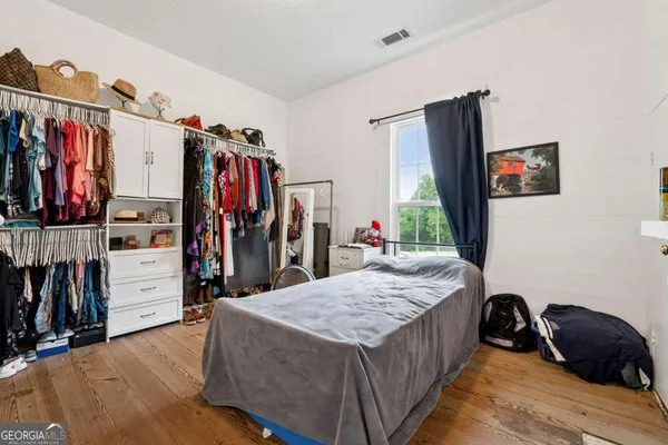 a bed room with a bed and a walk in closet