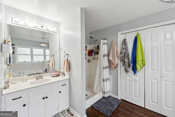 a bathroom with a double vanity sink and a mirror
