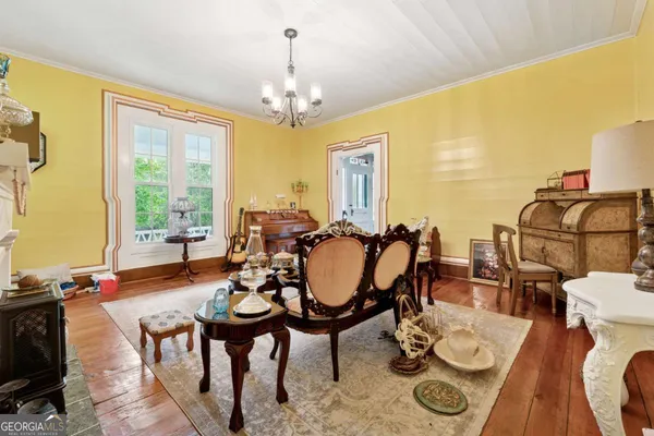 a view of a dining room with furniture window and outside view