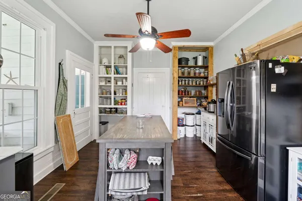 a kitchen with stainless steel appliances granite countertop a refrigerator and a stove
