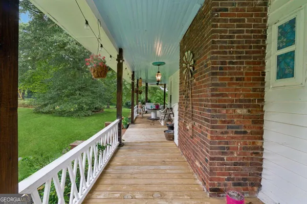 a view of a pathway both side of house