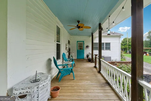a view of a porch with seating space