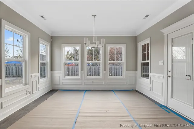 a view of empty room with windows
