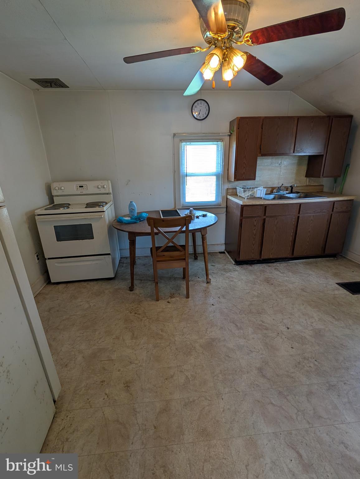 1988 Valley Road Parkesburg, PA 19365 - Photo 5 of 14 a kitchen with a stove a microwave and a chandelier