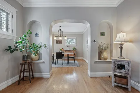 a workspace with furniture window and wooden floor