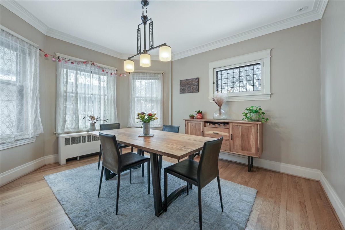 233 South Ridgeland Avenue Oak Park, IL 60302 - Photo 9 of 20 a view of a dining room with furniture window and wooden floor