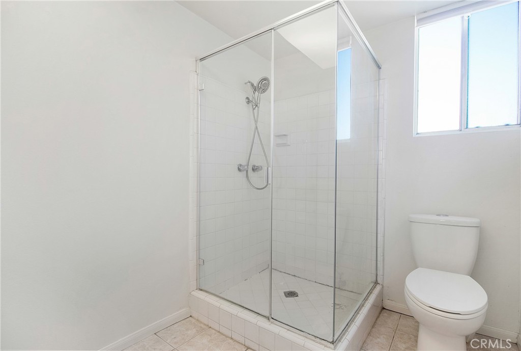 3808 Mistral Drive Huntington Beach, CA 92649 - Photo 17 of 28 a bathroom with a shower and toilet