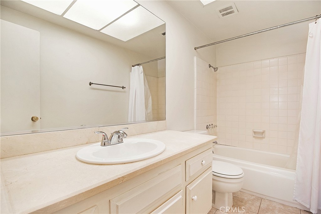 3808 Mistral Drive Huntington Beach, CA 92649 - Photo 23 of 28 a bathroom with a sink toilet a vanity and shower