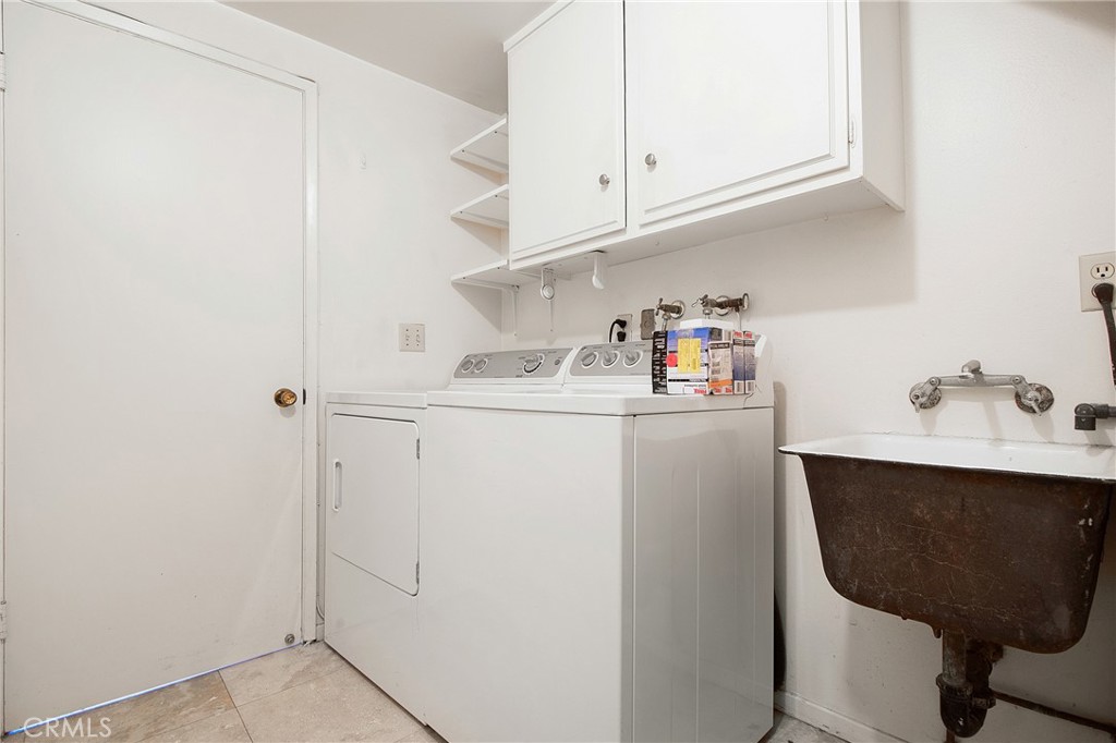 3808 Mistral Drive Huntington Beach, CA 92649 - Photo 5 of 28 a utility room with sink dryer and washer