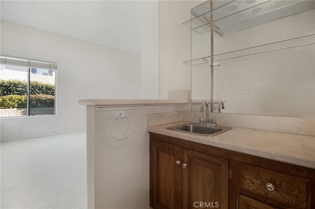 3808 Mistral Drive Huntington Beach, CA 92649 - Photo 8 of 28 a kitchen with a sink and cabinets