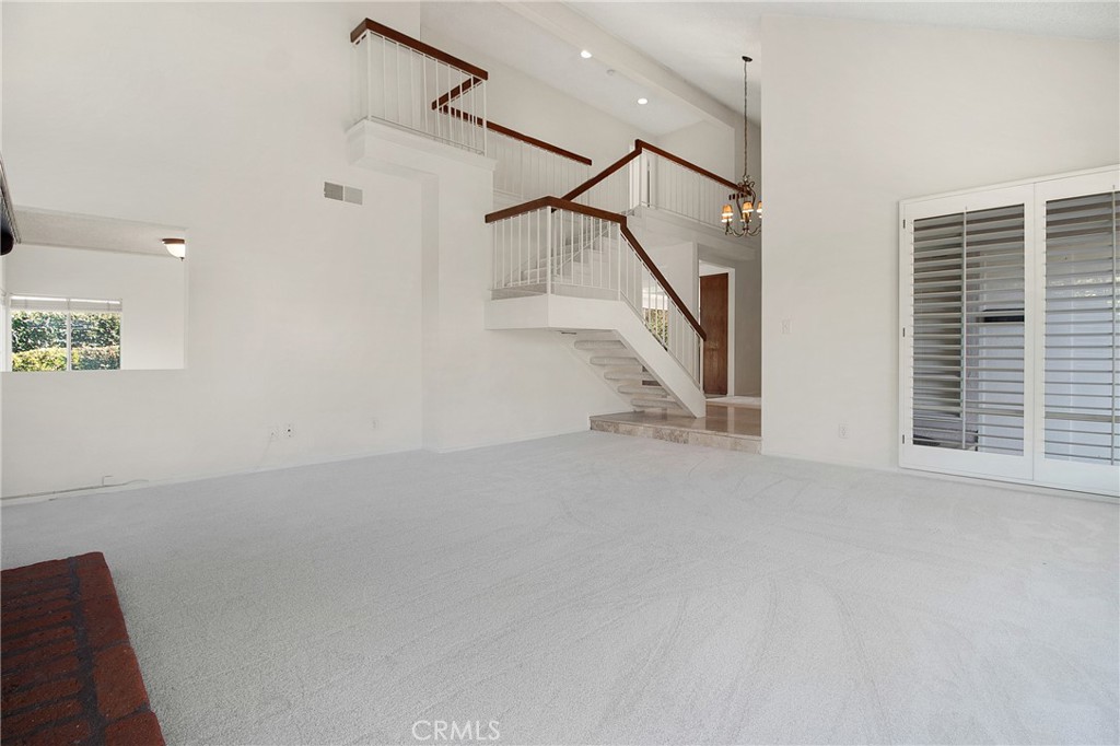 3808 Mistral Drive Huntington Beach, CA 92649 - Photo 9 of 28 a view of a room with stairs and mirrors