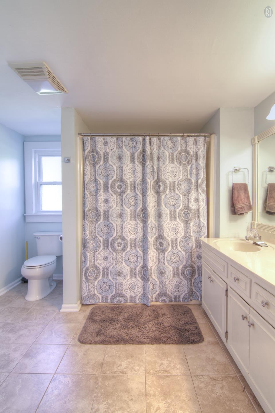 1081 Alford Road Murfreesboro, TN 37129 - Photo 15 of 30 a bathroom with a granite countertop sink a toilet and a shower