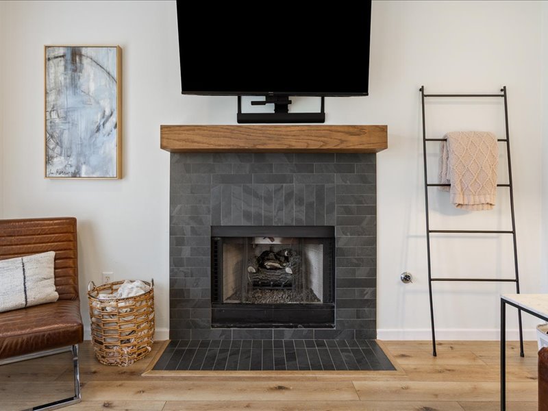 1205 South Main Street Georgetown, TX 78626 - Photo 12 of 35 a living room with furniture and a fireplace